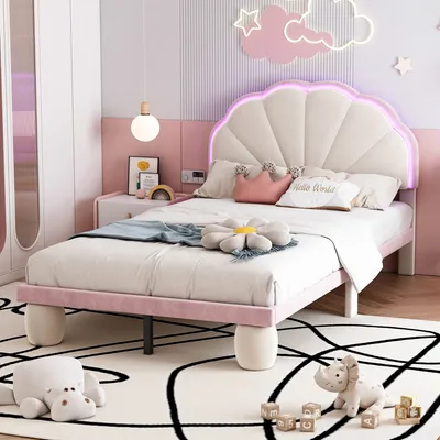 A child's bedroom with a pink and beige upholstered bed.