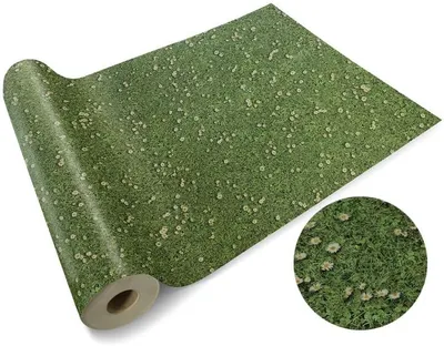 A roll of green ground cover with small white flowers, resembling grass, is shown on a white background. A circular inset shows a close-up of the ground cover.