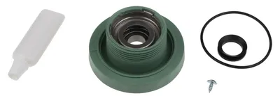 A collection of spare parts for a machine, including a green plastic component with metal parts inside, a small white bottle, and black rubber rings.