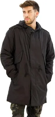 A man wearing a black parka and camouflage pants, posing against a white background.
