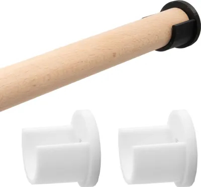 A close-up of a wooden dowel with black and white plastic components, likely for assembly or a DIY project.