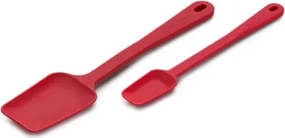 Two red silicone spatulas on a white background.