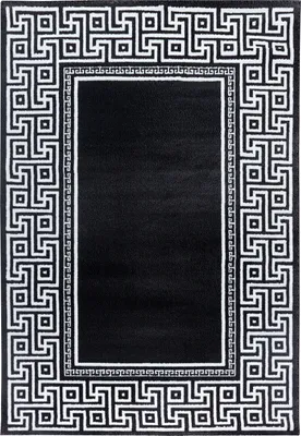 A black rug with a white geometric border.