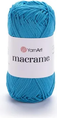 A ball of turquoise macrame yarn with a white label.