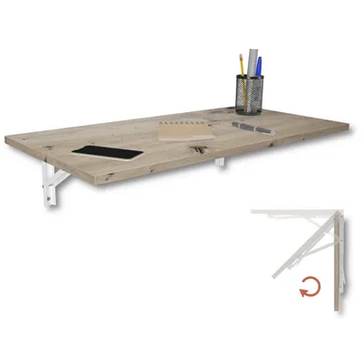 A wooden fold-down desk with white brackets, a smartphone, a notebook, pens, and a pen holder.