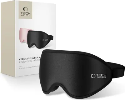 A black Tech-Protect eyeshade sleep mask is shown in the foreground, with its packaging in the background. The packaging displays an image of two sleep masks, one black and one pink.