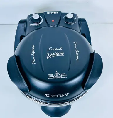 A top-down view of a black G3Ferrari Pizzamaker Delizia on a white background.