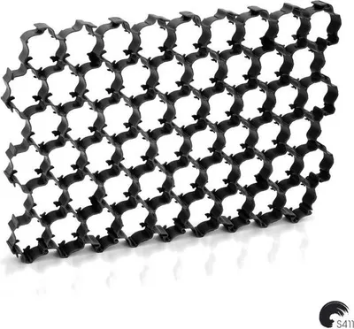 A black plastic parking grid is shown against a white background.