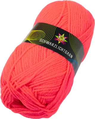 A ball of neon orange yarn with a black label.