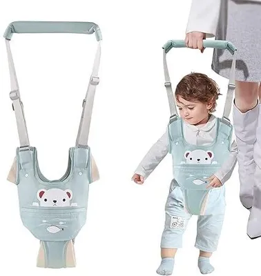 Produktbild von Baby Gehgeschirr, Handgeführte Lauflernhilfe mit abnehmbarem Schrittgurt, verstellbar, für Babys von 9-24 Monaten (Grün),unterstützt das Laufenlernen.