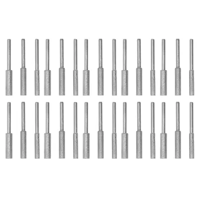 A set of 30 chainsaw sharpening stones arranged in two rows on a white background.