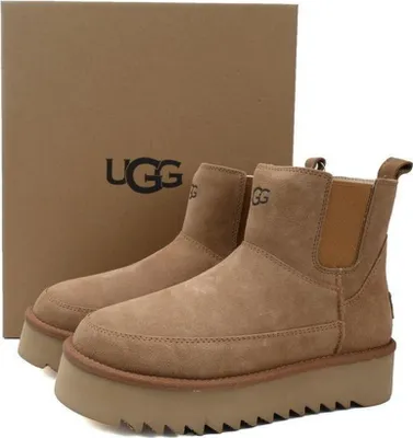 A pair of UGG boots and their original packaging box.