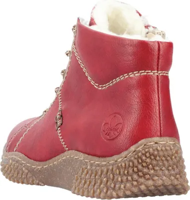 A red leather boot with white fur lining is shown from the side and back.