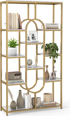 A gold and white geometric bookshelf filled with decorative items.