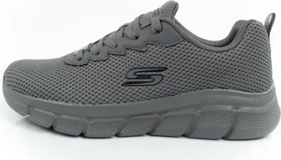 A side view of a gray Skechers sneaker against a white background.