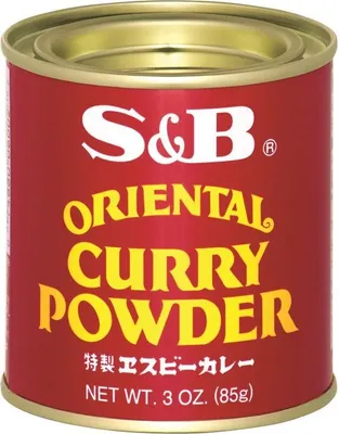 A product shot of a can of S&B Oriental Curry Powder.