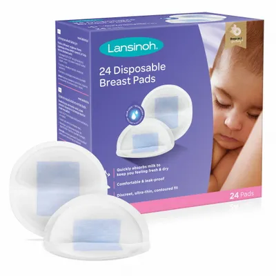 A box of Lansinoh disposable breast pads with two pads shown in front of the box. A baby's face is visible on the right side of the box.