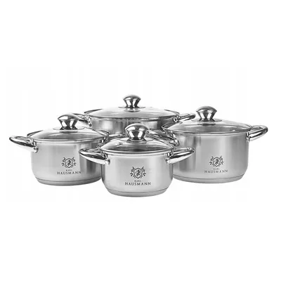 A set of four stainless steel pots with glass lids, arranged in a group against a white background.