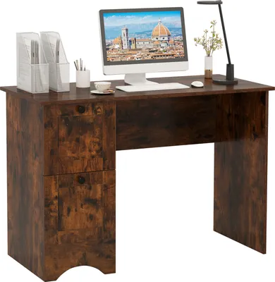 A rustic brown computer desk with two drawers and a computer monitor on top.