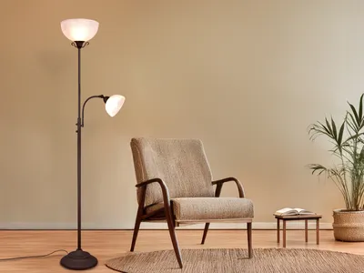 A floor lamp and an armchair in a room.