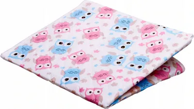 A folded baby changing pad with an owl pattern.