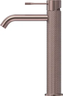 A close-up studio shot of a tall, copper-colored bathroom faucet with a textured diamond pattern on its base and handle.