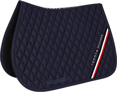 A navy blue quilted saddle pad with a Tommy Hilfiger logo and stripes on the side.