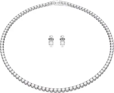 A diamond necklace and matching earrings are displayed on a white background.