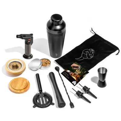 A collection of cocktail making tools and smoking accessories laid out on a white background.