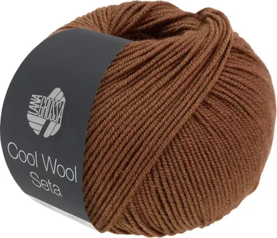 A ball of brown yarn with a label.