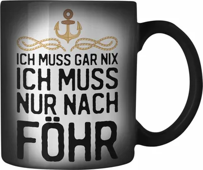Produktbild von Trendation - Insel Föhr Geschenk Farbwechsel Zauber-Tasse Geschenkiee Ich Muss Gar Nix Ich Muss Nur Nach Föhr Karabiner Farbwechsel Zauber-Tasse Edelstahl (Schwarz)