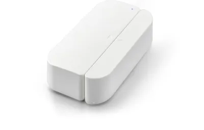 A white door and window sensor is shown on a white background.