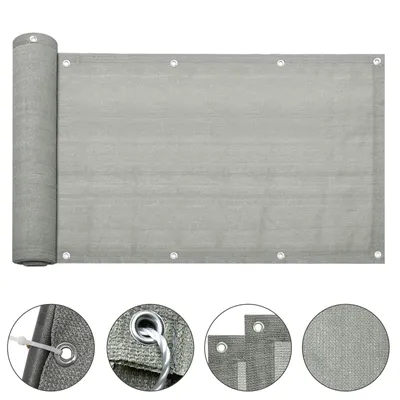A rolled-up privacy screen for a balcony, shown with close-up details of its grommets and material.