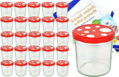 A set of glass jars with red and white mushroom-shaped lids, along with a recipe booklet.
