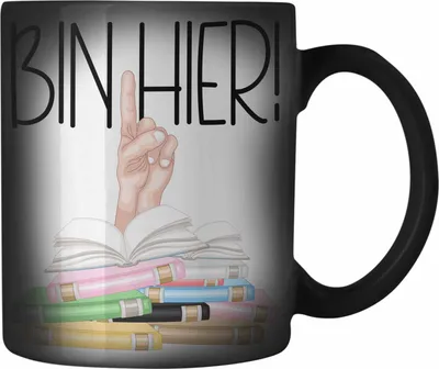 Produktbild von Trendation - Leseratte Geschenk Farbwechsel Zauber-Tasse Buch Grafik Bücher Lesen Bücherwurm Geschenk Spruch Lesen Bin hier (Schwarz)