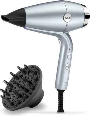 A silver hair dryer with a black diffuser attachment on a white background.