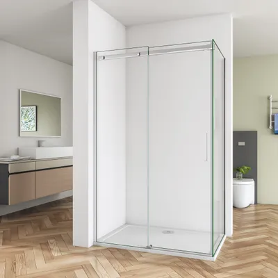 A modern bathroom with a glass shower enclosure, vanity, and toilet.