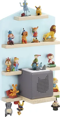 A wall-mounted shelf unit displaying various toy figurines and a grey audio player.