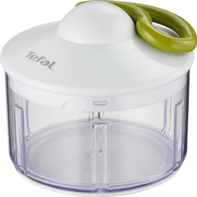A white and green manual food chopper with a transparent container.