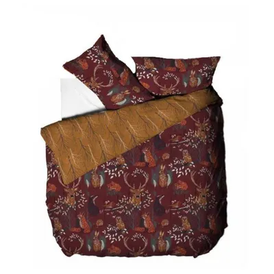 A folded duvet and pillow set with a forest animal print.