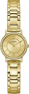 A close-up studio shot of a gold Guess watch.