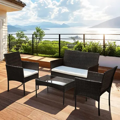 Immagine prodotto di Set da giardino in rattan sintetico Eikuavons, composto da 4 pezzi: divano, 2 sedie, tavolino in vetro e cuscini per seduta, ideale per balcone o terrazza, colore marrone