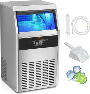 A commercial ice maker with ice inside, along with accessories like a water filter, ice scoop, and lime slices.