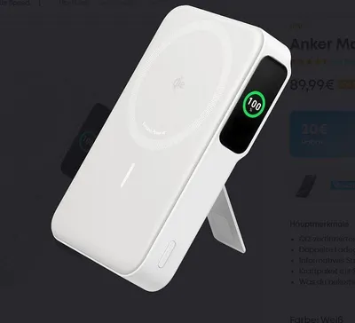 A white wireless power bank is displayed on a stand, with a digital display showing 100% charge. The background is dark, and there is text and pricing information visible on the right side of the image.