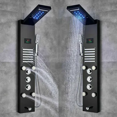 Two black shower panels with LED lights and multiple shower heads are mounted on a gray tiled wall.