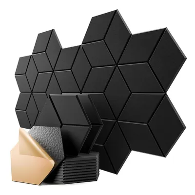 A collection of black acoustic panels arranged in a geometric pattern, with a stack of panels and adhesive backing in the foreground.