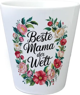 A white ceramic pot decorated with a floral wreath and text.