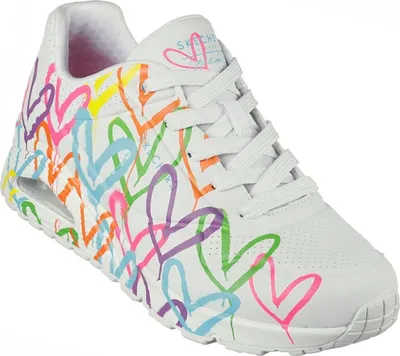 A white sneaker with a colorful heart pattern.