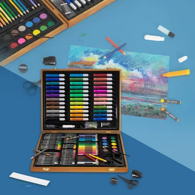 An open art supply case with various art supplies laid out, including markers, colored pencils, watercolors, and pastels. A partially completed drawing is also visible.