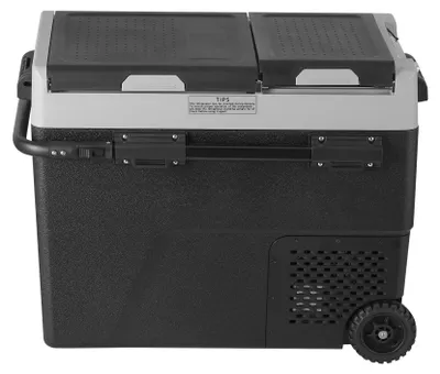A black and gray portable cooler with wheels and a handle, shown from the side.